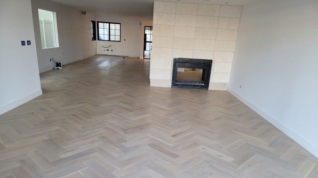 Vinyl flooring in a modern living room with grey and white color scheme