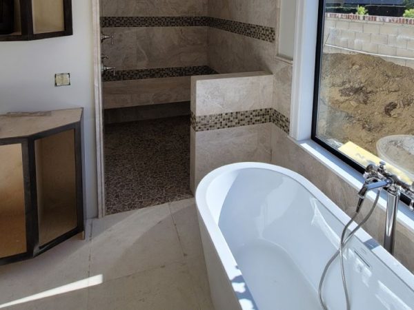 bathroom with tile installation in shower