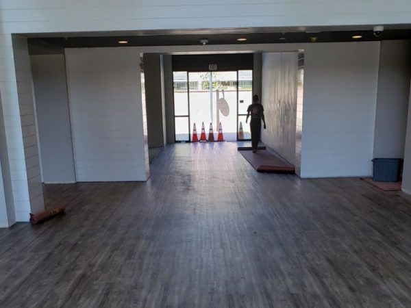 Commercial flooring installation with gray and white patterned tiles