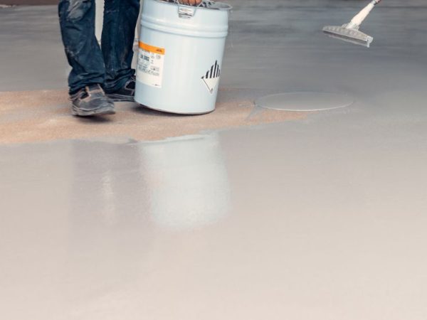 professional laying epoxy floor coating