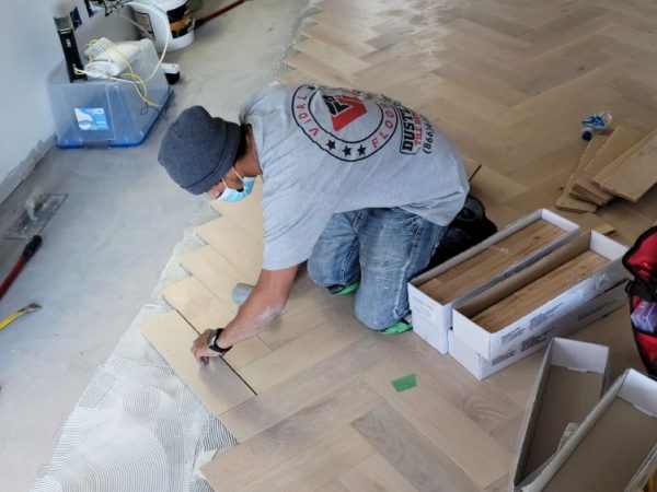professional installing hardwood flooring