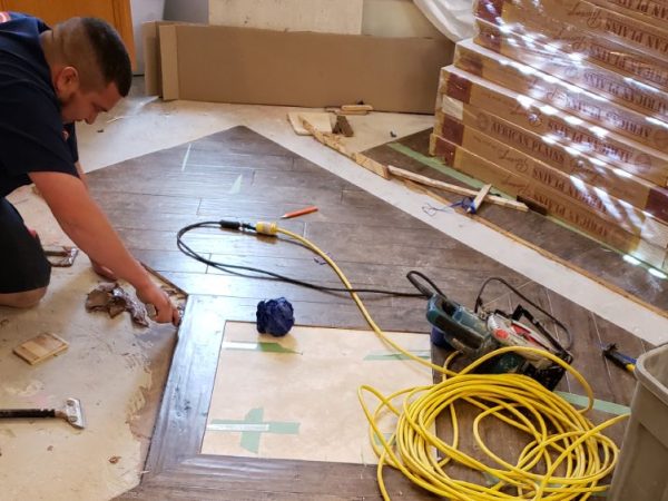 professional installing hard wood flooring